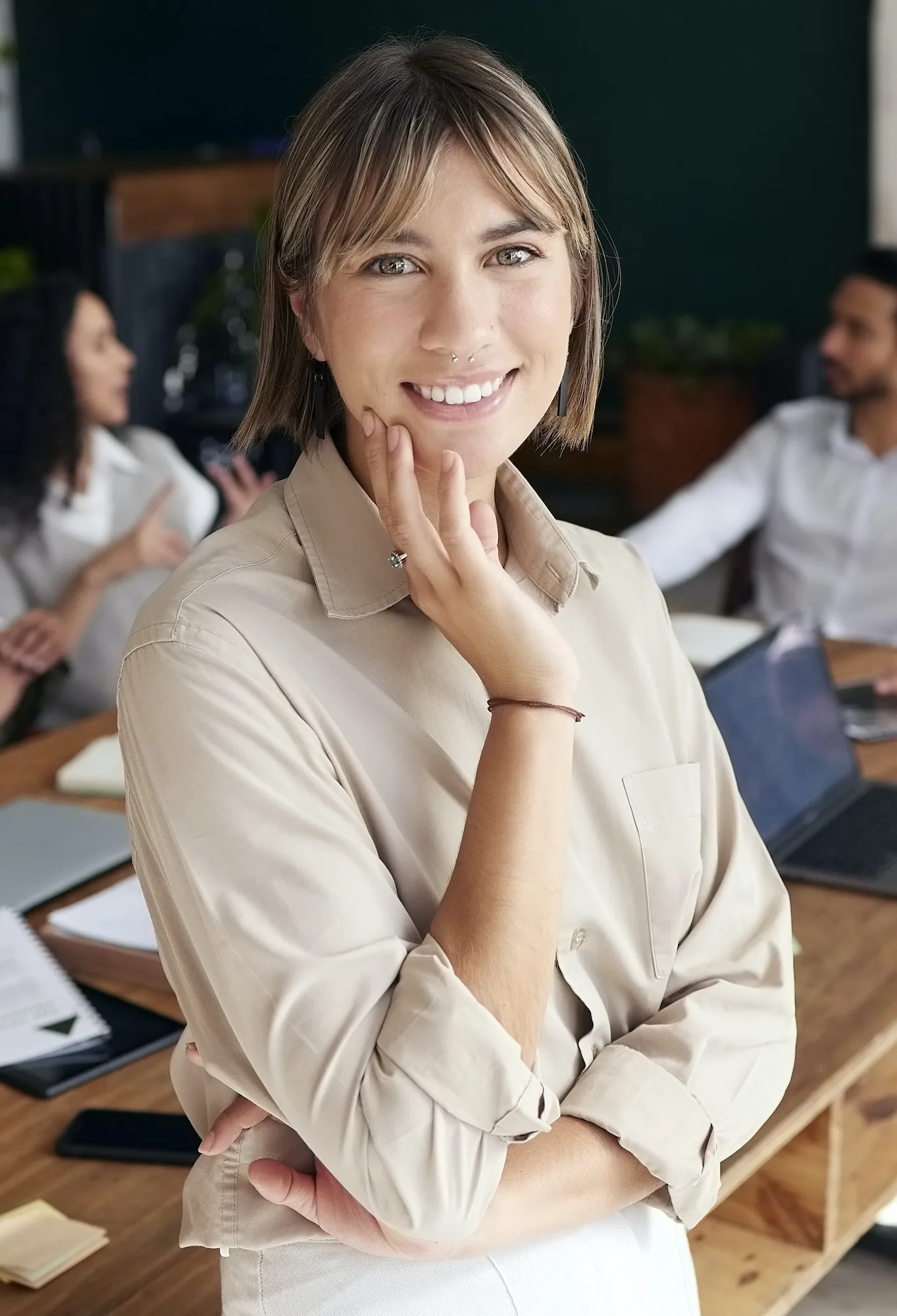 Portrait, smile and professional with a business woman intern standing in the office for coaching o